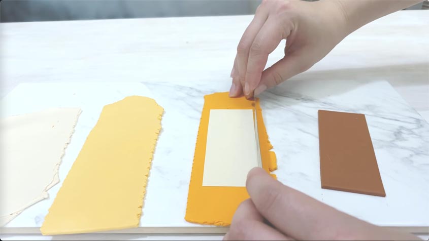 cutting rectangles out of slabs of polymer clay