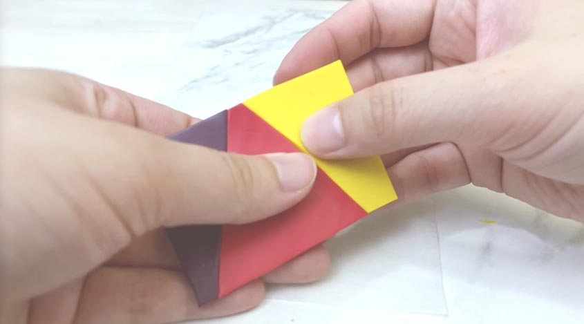 mauve, red and yellow triangles pieced together